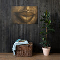 Close-up of lips rendered in gleaming gold, sculptural against deep shadow.