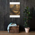 Close-up of lips rendered in gleaming gold, sculptural against deep shadow.