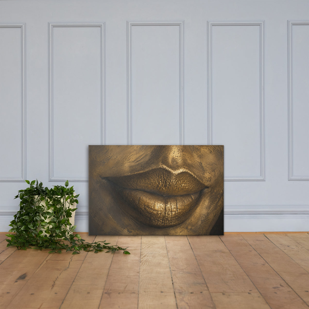 Close-up of lips rendered in gleaming gold, sculptural against deep shadow.