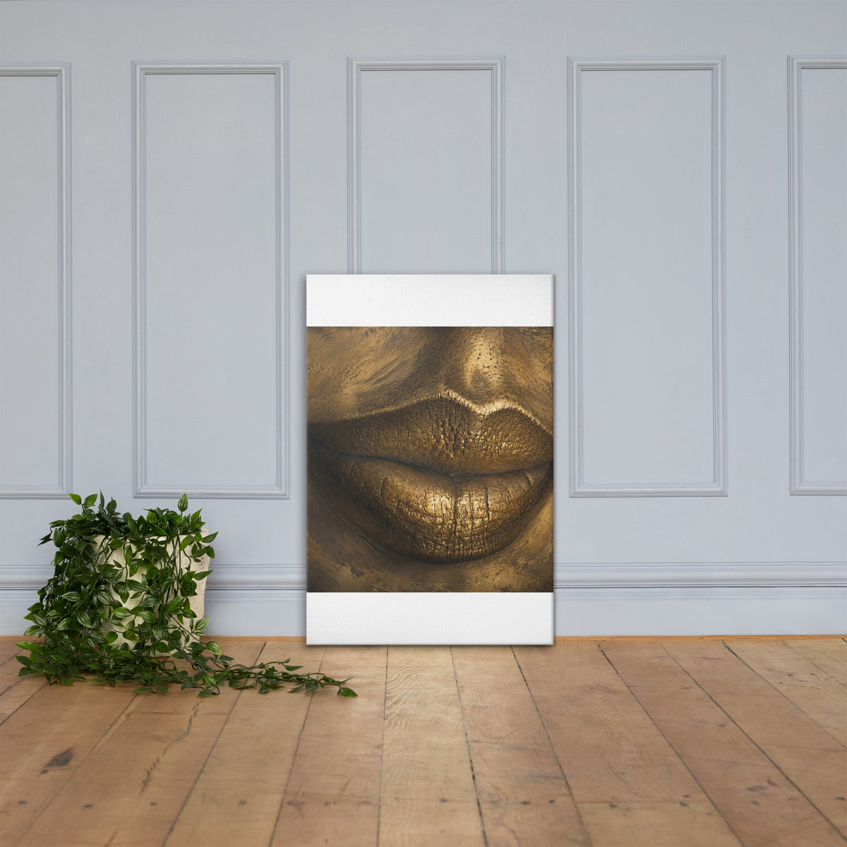 Close-up of lips rendered in gleaming gold, sculptural against deep shadow.